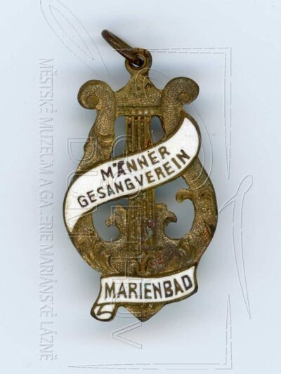 Odznak nejstaršího mužského pěveckého v Mariánských Lázních z doby okolo roku 1900
